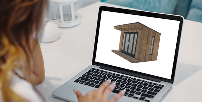 Person designing a garden room on a laptop computer.