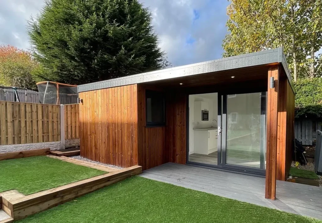 cedar Clad Garden Room with large sliding door and porch canopy at the front