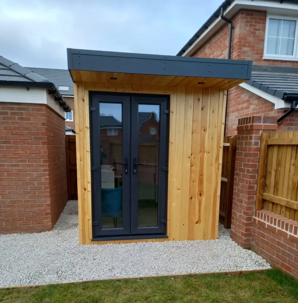 GARDEN OFFICE CLADD IN LARCH WOOD CLADDING