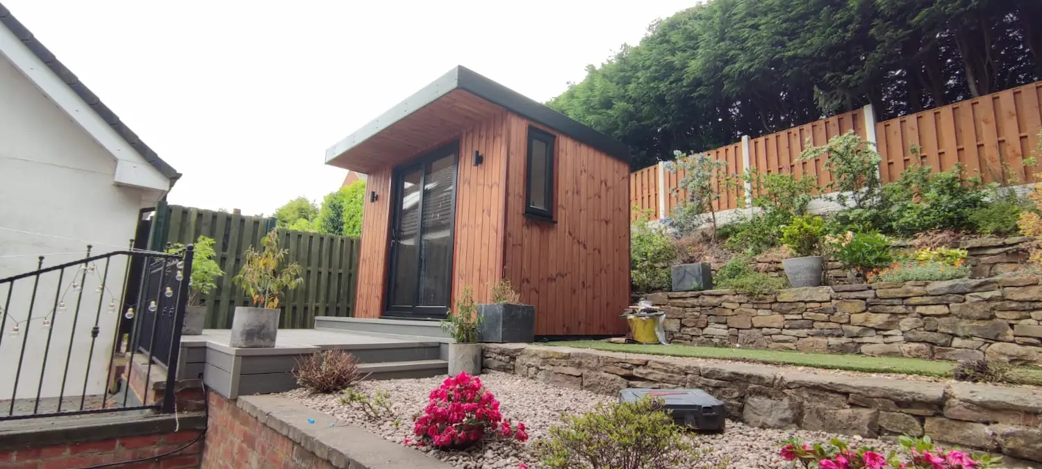 Thermowood Clad Garden Room situated in a stepped garden