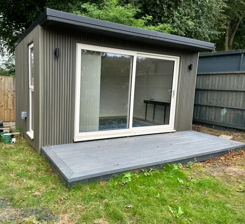 LUXURY GARDEN OFFICE CLADD IN COMPOSITE ANTIQUE GREEN SLATTED CLADDING